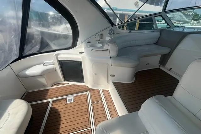 Slide: The Image of 2004 Cruisers Yachts 3372 Express interior with seating and wood flooring. - 22
