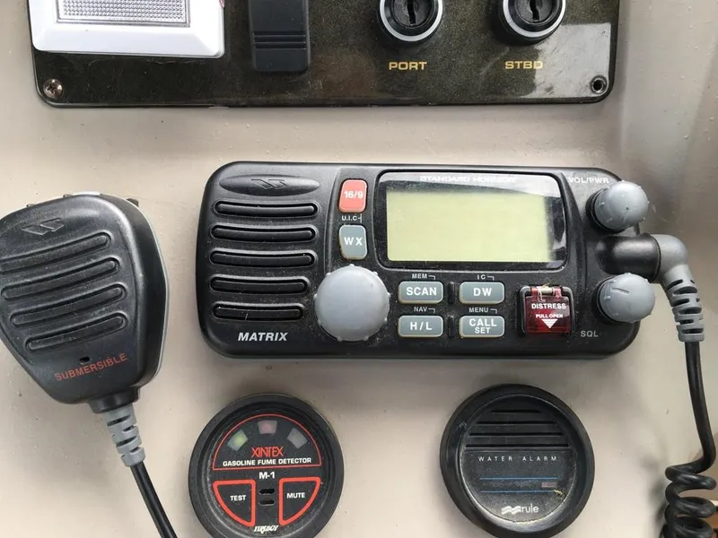 Slide: The Image of Boat controls with radio and alarms, Cruisers Yachts 3372 Express 2004. - 35