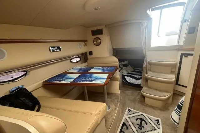 Slide: The Image of Interior of 2004 Cruisers Yachts 3372 Express with seating and dining area. - 40
