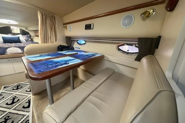 Slide: The Image of Interior of 2004 Cruisers Yachts 3372 Express with dining area and nautical decor. - 41