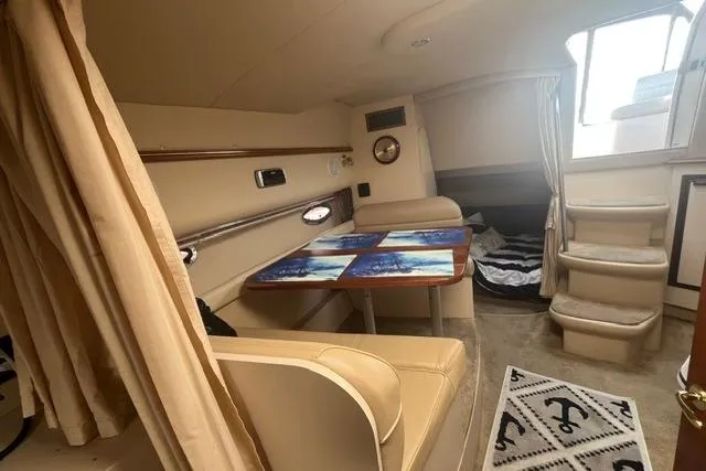 Slide: The Image of Interior of 2004 Cruisers Yachts 3372 Express with seating and table. - 45
