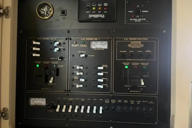Slide: The Image of Electrical control panel of a 2004 Cruisers Yachts 3372 Express boat. - 58