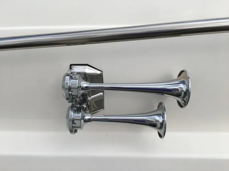Slide: The Image of Chrome horns on a 2004 Cruisers Yachts 3372 Express boat. - 6