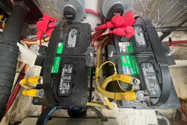 Slide: The Image of 2004 Cruisers Yachts 3372 Express engine compartment with dual marine batteries. - 65