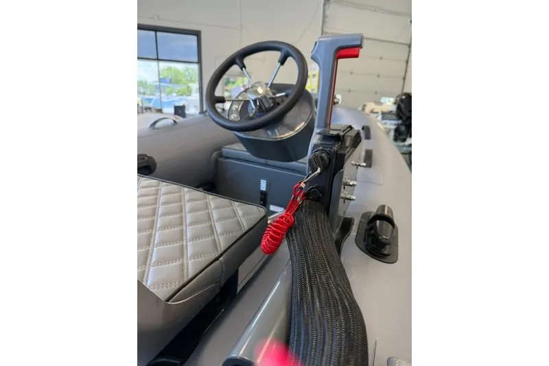 Slide: The Image of Interior of 2026 Desner CL310 FCT boat with steering wheel and throttle control. - 4