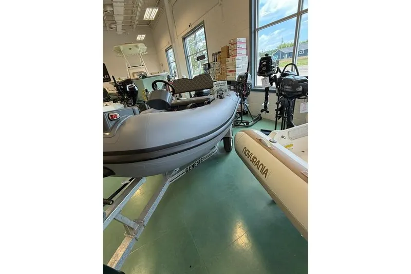 Slide: The Image of 2026 Desner CL310 FCT inflatable boat displayed indoors with equipment. - 6