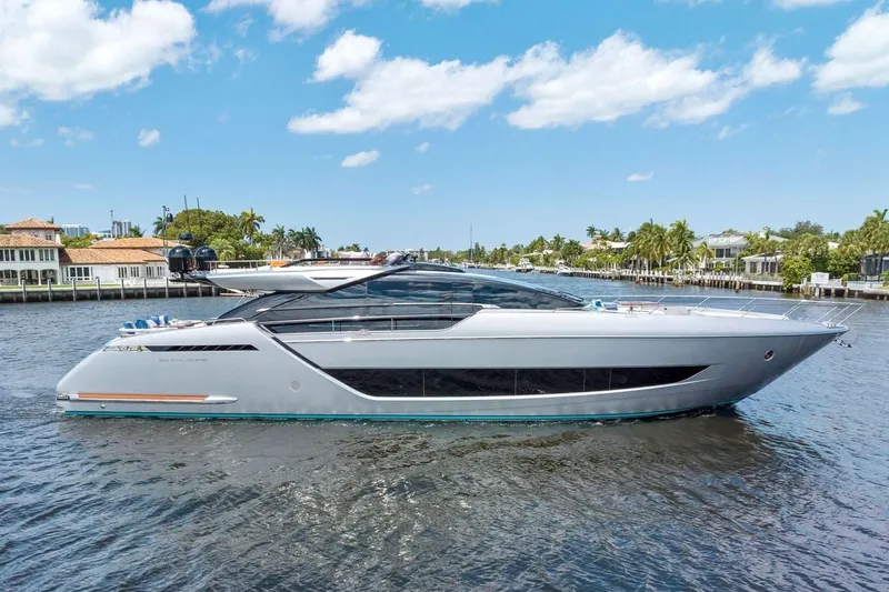 The Image of Luxury 2022 Riva 88' Folgore yacht cruising on a sunny day, showcasing sleek design. - 0