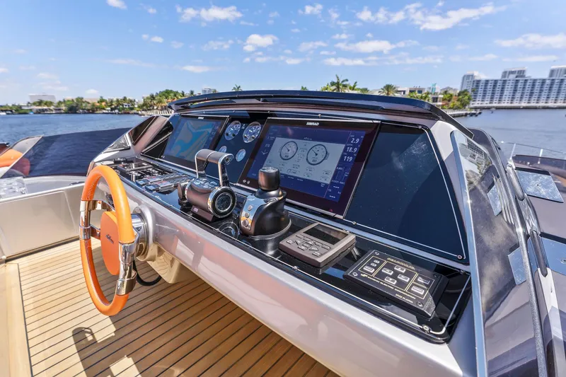Slide: The Image of Riva 88' Folgore 2022 yacht cockpit with modern controls. - 27