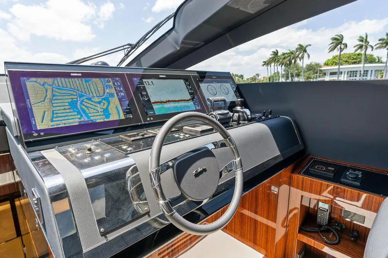 Slide: The Image of Cockpit of 2022 Riva 88' Folgore yacht with modern navigation systems. - 42