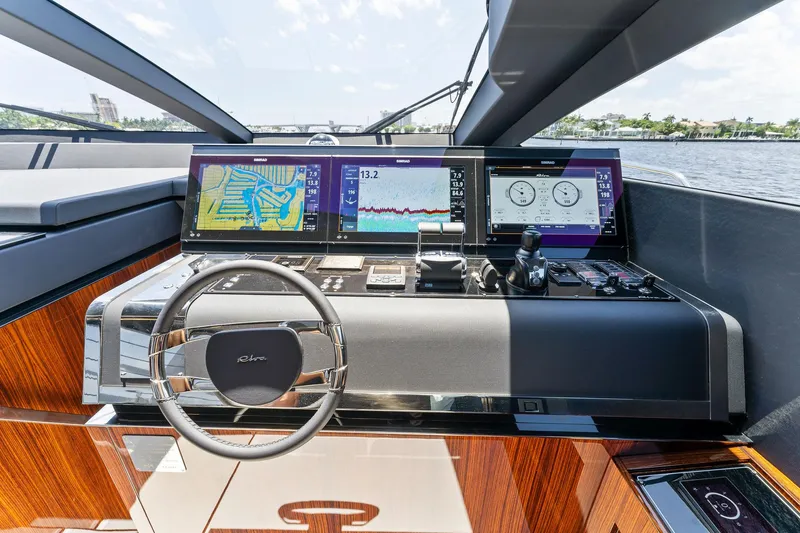 Slide: The Image of Cockpit of Riva 88' Folgore yacht, 2022 model, on the water. - 43