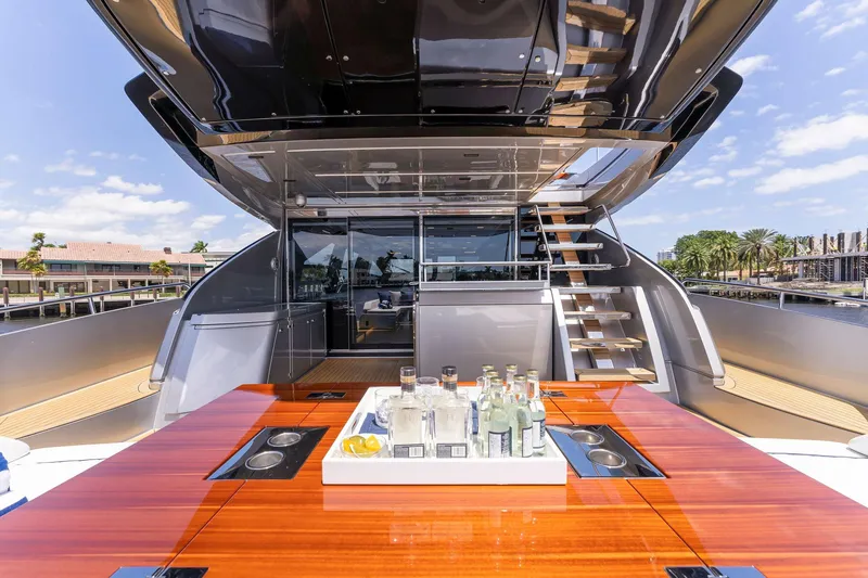 Slide: The Image of Luxury yacht Riva 88' Folgore 2022 with stylish deck and bar area. - 8