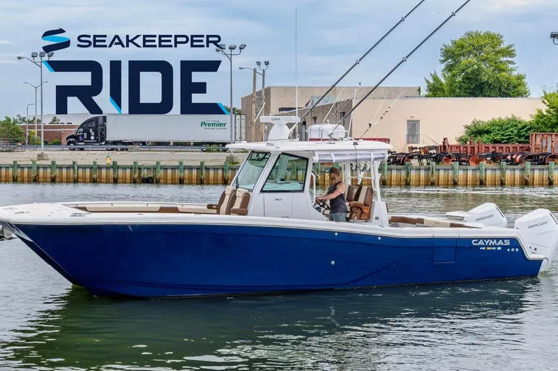The Image of 2024 Caymas 34 CT boat on water, featuring Seakeeper Ride technology. - 0