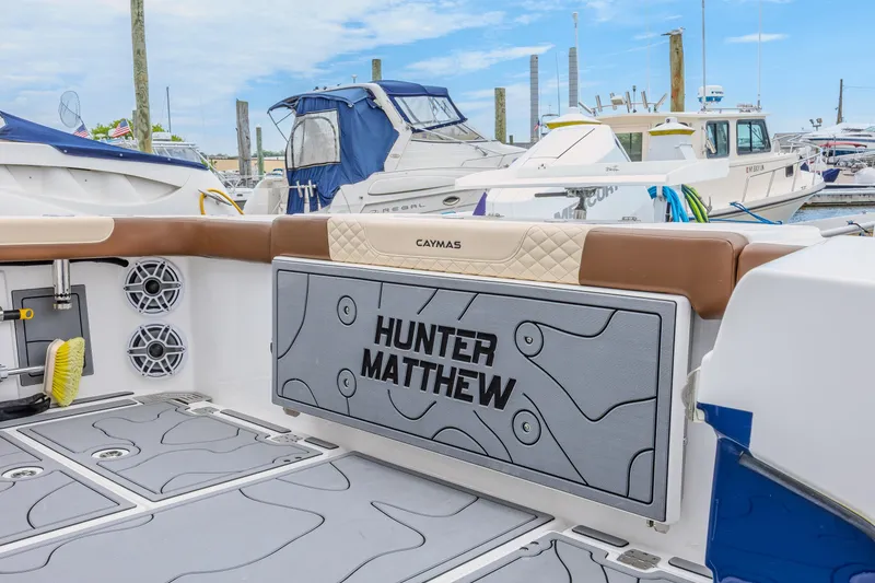 Slide: The Image of 2024 Caymas 34 CT boat interior with custom panel, docked at marina. - 16