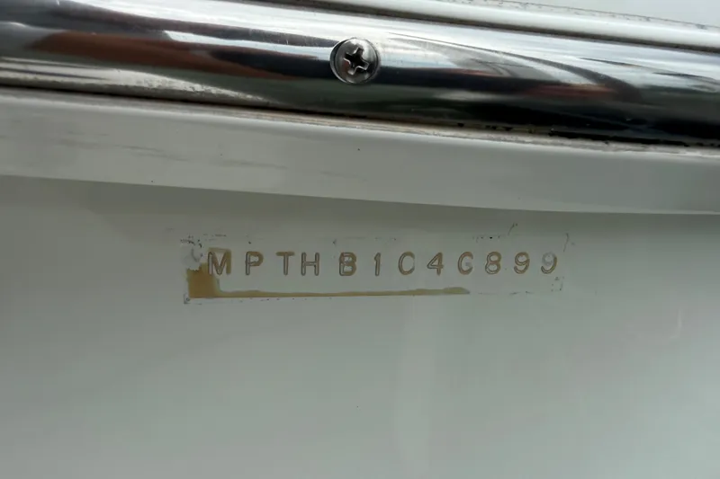 Slide: The Image of Hull identification number on 1999 Mainship 350 Trawler boat. - 37