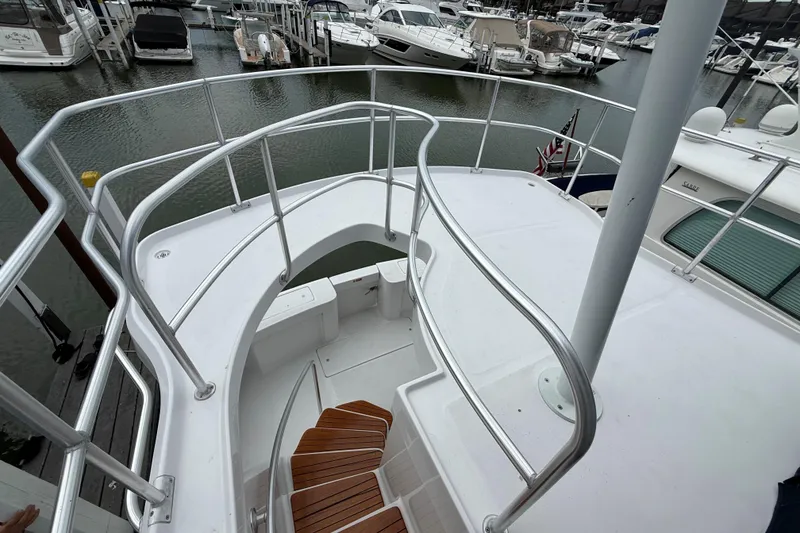 Slide: The Image of 1999 Mainship 350 Trawler deck with railing, docked at marina. - 12