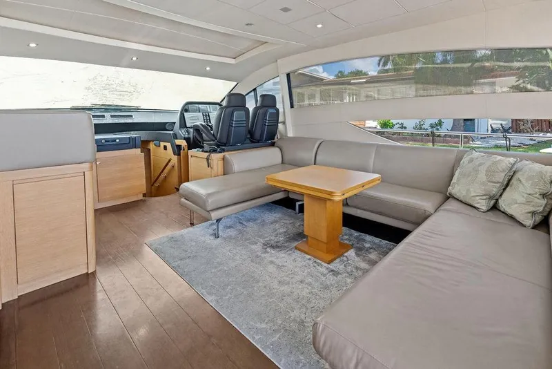 Slide: The Image of Luxurious interior of 2013 Pershing 64 yacht with modern seating and helm station. - 23