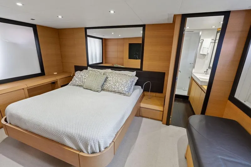Slide: The Image of Luxurious bedroom interior of 2013 Pershing 64 yacht with modern design and ensuite bathroom. - 28