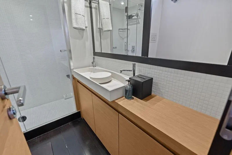 Slide: The Image of Modern bathroom in 2013 Pershing 64 yacht with sleek vanity and glass shower. - 32