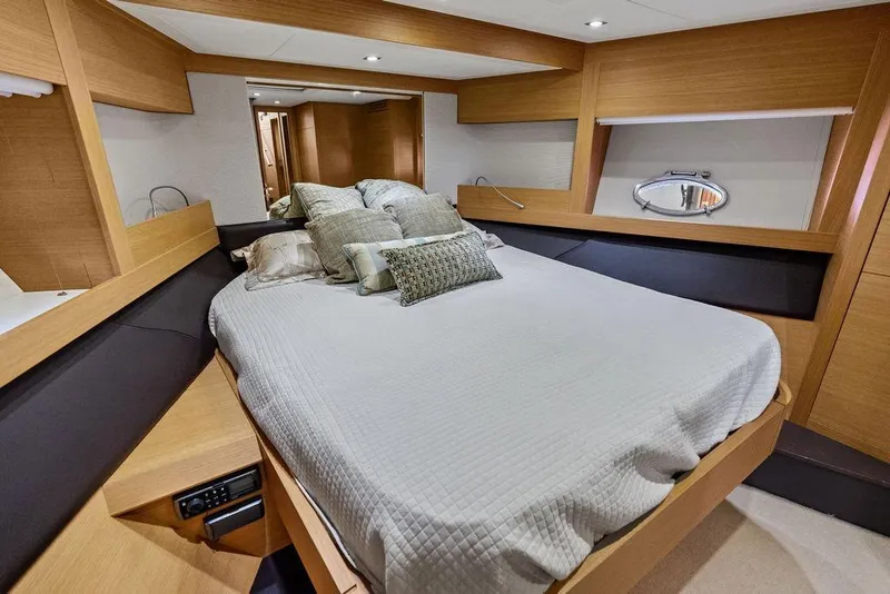 Slide: The Image of Luxurious bedroom interior of a 2013 Pershing 64 yacht with modern design. - 34