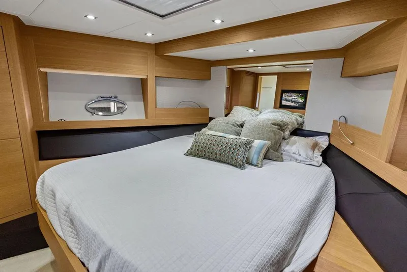 Slide: The Image of Luxurious bedroom interior of 2013 Pershing 64 yacht with modern design and cozy bedding. - 35