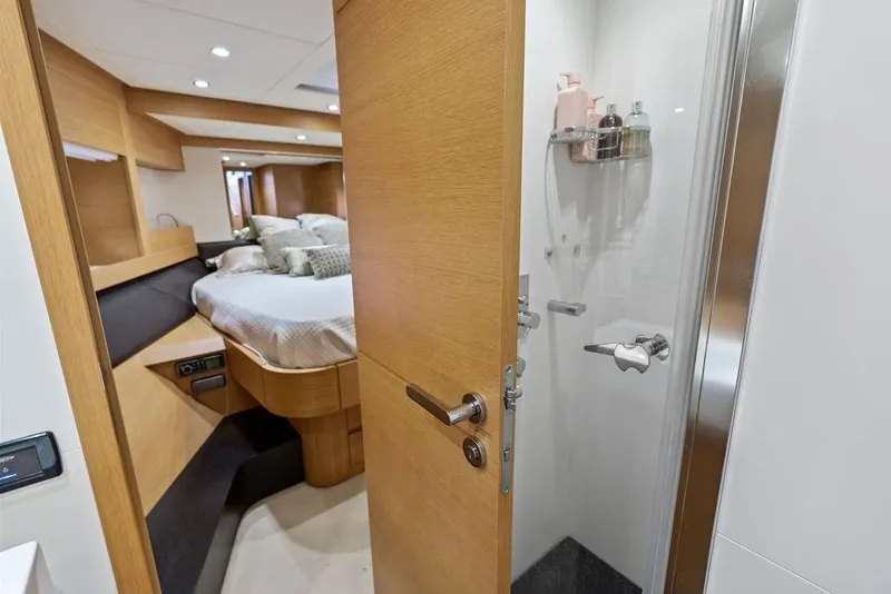 Slide: The Image of Luxurious cabin interior of 2013 Pershing 64 yacht with modern shower and cozy bed. - 37