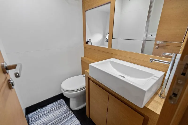Slide: The Image of Modern bathroom on 2013 Pershing 64 yacht with sleek sink and toilet. - 38