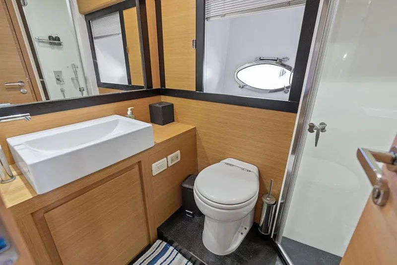 Slide: The Image of Modern bathroom interior on 2013 Pershing 64 yacht, featuring sink, toilet, and shower. - 41