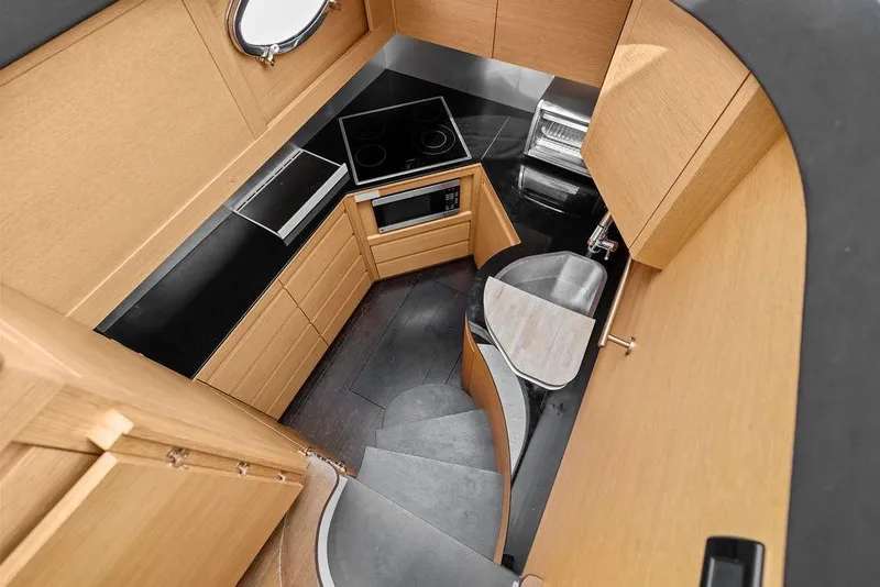 Slide: The Image of Modern kitchen interior of 2013 Pershing 64 yacht with sleek cabinetry and appliances. - 42