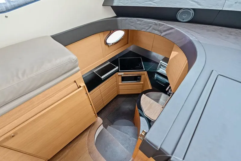Slide: The Image of Luxurious 2013 Pershing 64 yacht interior kitchen with modern appliances and sleek design. - 43