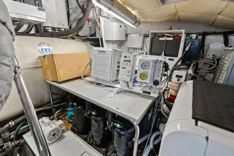 Slide: The Image of Engine room of a 2013 Pershing 64 yacht with technical equipment and gauges. - 50