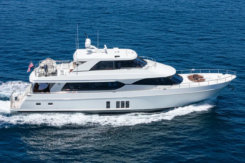 Slide: The Image of A luxurious motor yacht cruising on open water. It features a sleek, modern design. - 11