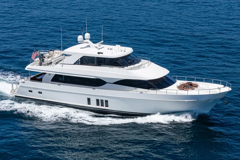 Slide: The Image of A luxurious motor yacht with multiple decks cruising on open water. - 12