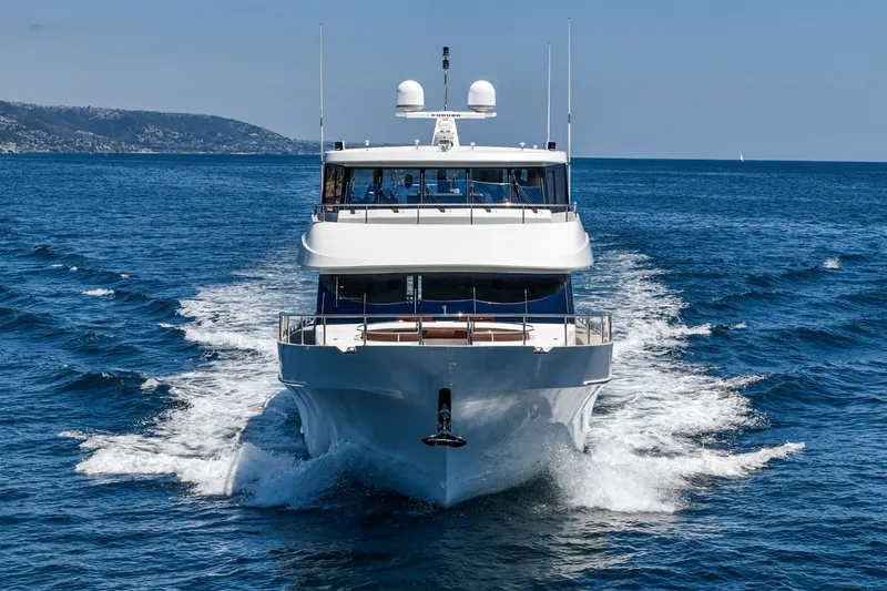 Slide: The Image of 2015 Ocean Alexander 90 Skylounge Motoryacht cruising on the sea. - 14
