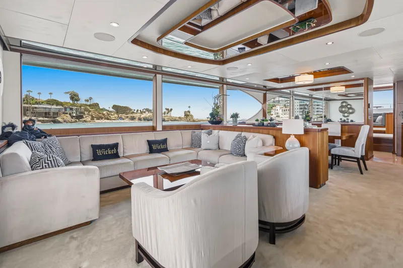 Slide: The Image of Luxurious salon with large windows, white sofas, and elegant wood accents on a yacht. - 33