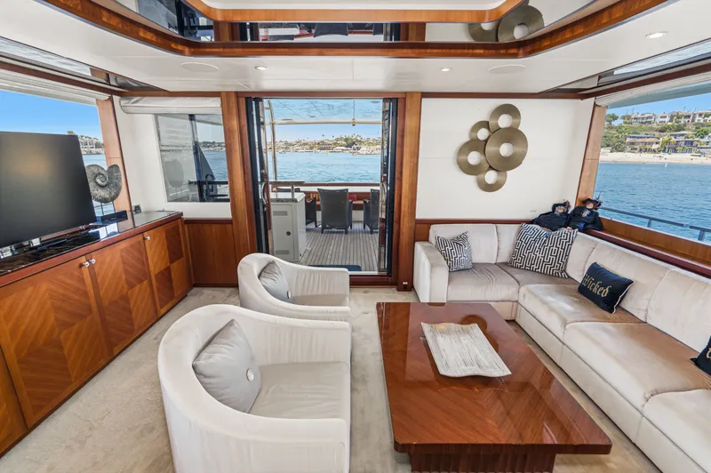 Slide: The Image of Luxurious salon with elegant furniture and large windows offering a view of the water. - 35