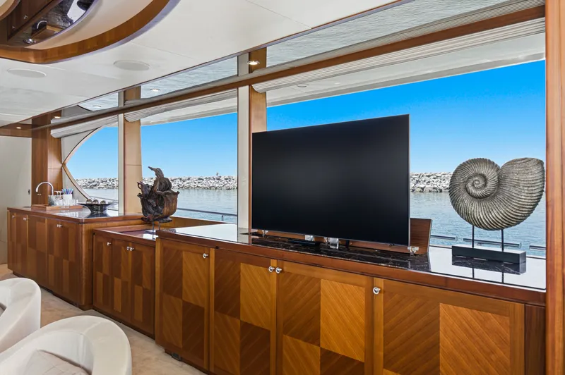 Slide: The Image of Interior of the Ocean Alexander 90 Skylounge Motoryacht with elegant wood furnishings and large windows. - 41