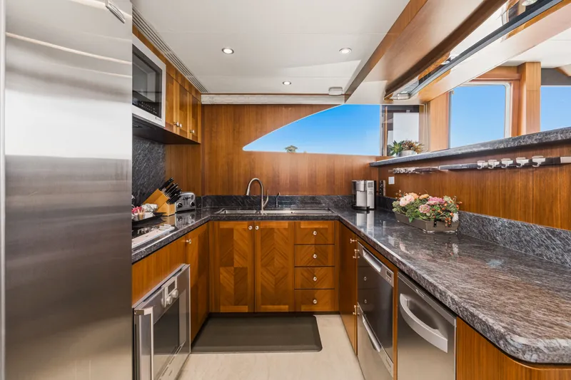 Slide: The Image of Luxurious kitchen with wood cabinets and granite countertops on a yacht. - 47