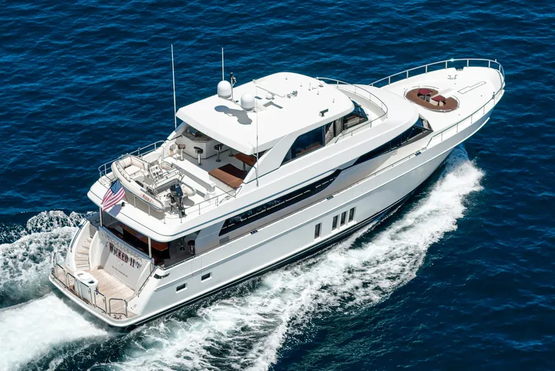 Slide: The Image of A luxurious motor yacht cruising on open water. It features a spacious deck and modern amenities. - 9