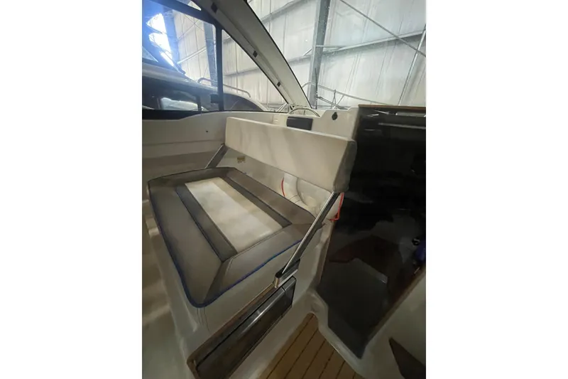 Slide: The Image of Interior view of a 2017 Cutwater C-24 Coupe boat, showcasing seating and cabin details. - 12