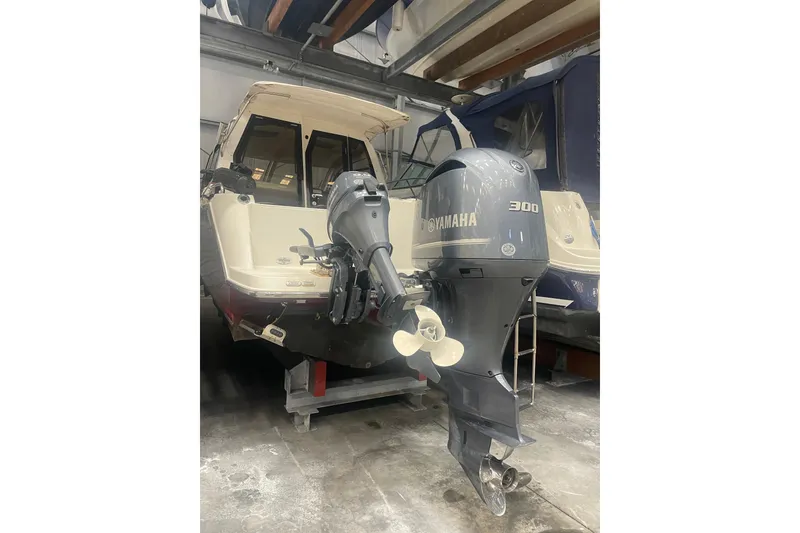 Slide: The Image of 2017 Cutwater C-24 Coupe with Yamaha 300 outboard motor in storage. - 18