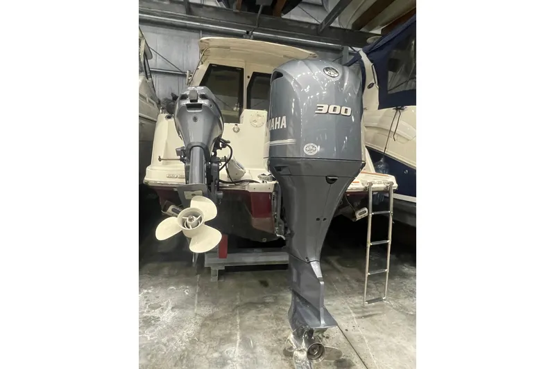Slide: The Image of 2017 Cutwater C-24 Coupe with Yamaha 300 outboard motor in storage. - 2