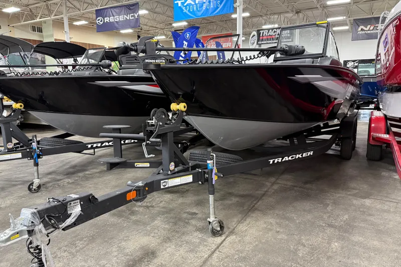 The Image of 2026 Tracker Targa V-19 WT boat on display in showroom with trailer. - 0