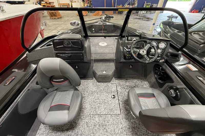 Slide: The Image of Interior of 2026 Tracker Targa V-19 WT boat with dual seats and modern dashboard. - 16