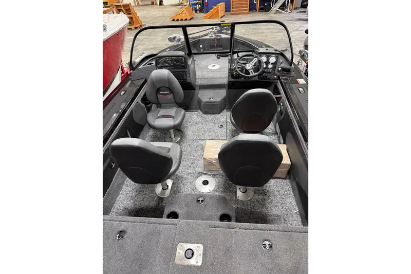 Slide: The Image of 2026 Tracker Targa V-19 WT boat interior with four seats and steering console. - 18