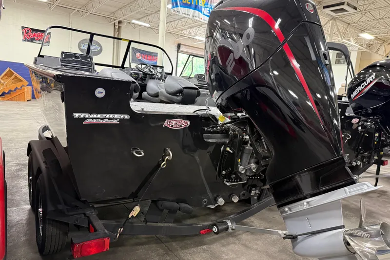 Slide: The Image of 2026 Tracker Targa V-19 WT boat with powerful outboard motor in showroom. - 20