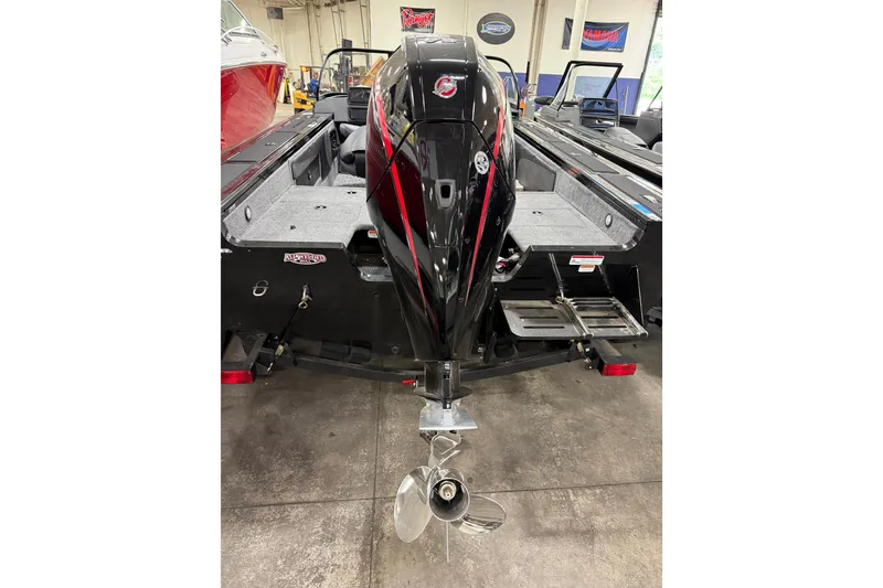 Slide: The Image of 2026 Tracker Targa V-19 WT boat with powerful outboard motor in showroom. - 21