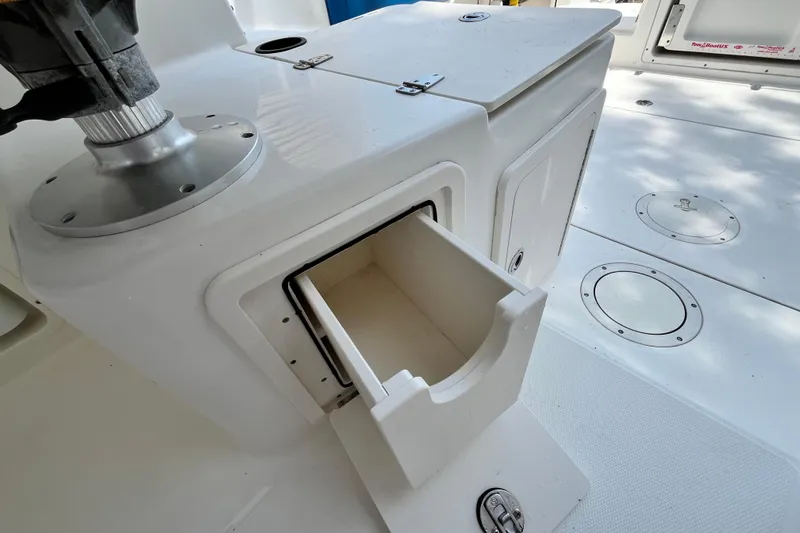 Slide: The Image of Open storage compartment on a 2006 Boston Whaler 285 Conquest boat deck. - 24