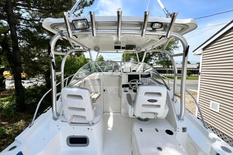 Slide: The Image of 2006 Boston Whaler 285 Conquest boat interior with helm and seating area. - 25