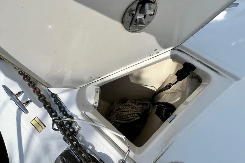 Slide: The Image of Anchor storage compartment on a 2006 Boston Whaler 285 Conquest boat. - 44