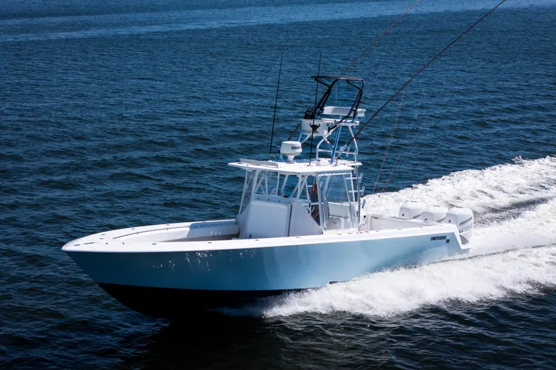The Image of 2015 Contender 39 ST boat cruising on open water. - 0